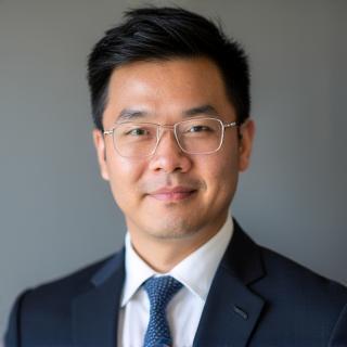 Professional headshot of David Chen